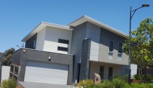 A custom double storey home built on a down slope block