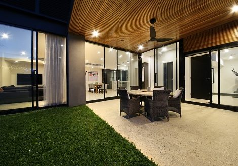 Custom built home showing under cover outdoor area with a selection of windows