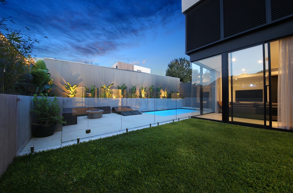 custom home backyard with pool and modern rear facade